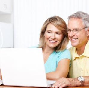 old couple smiling at computer2
